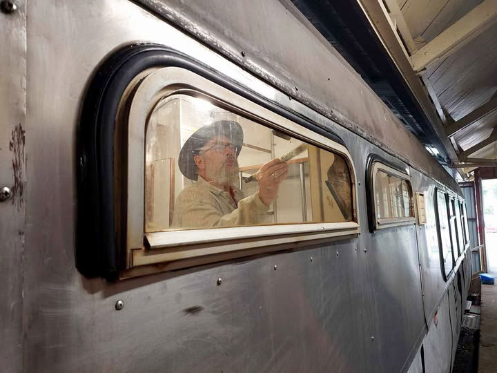 Project leader David reinstalling quarterlight windows